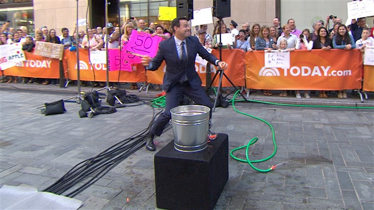 كارسون and his one slowly-filled water balloon were no match for Malone and his bucket full of quickly-filled ones during a water balloon fight in Rockefeller Plaza. 