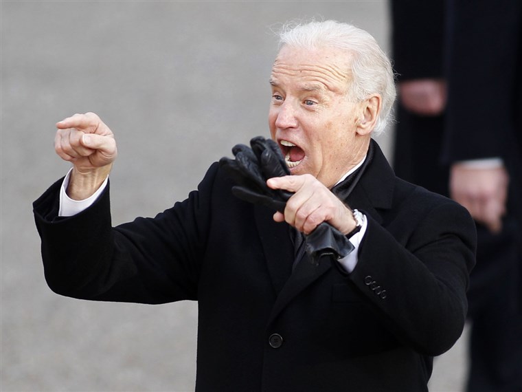 نائب President Joe Biden waves to the crowd in his usual animated fashion during the inaugural parade.