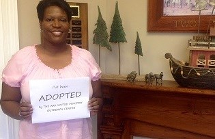 Töpfer Brown, one of the moms adopted through the Ark's program, received flowers and a card as a part of her adoption.