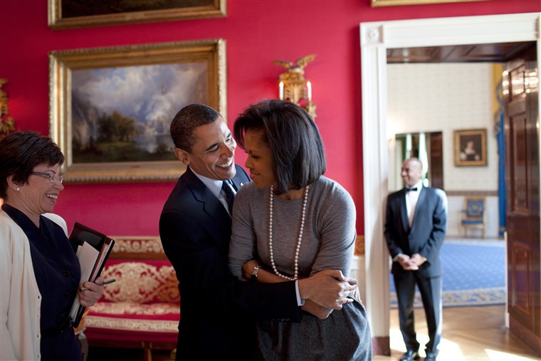 Barack Obama hugs Michelle Obama