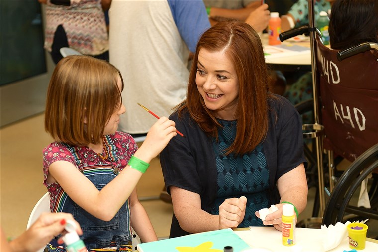 Alyson Hannigan and daughter, Satyana, with Starlight Children's Foundation at LAC USC Medical Center
