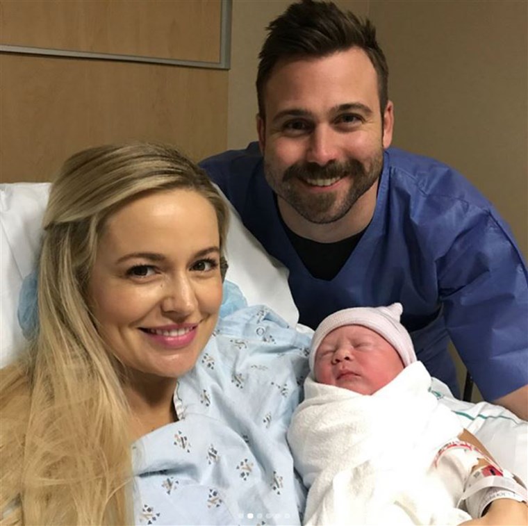 إميلي Maynard and her husband Tyler Johnson pose with their new little boy.