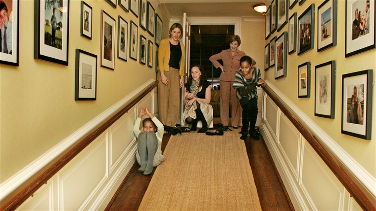 Laura Bush, Jenna Hager and Barbara Bush welcome Michelle Obama, her mother, Marian Robinson, and her children Malia and Sasha for a tour of the White House. The girls slide down the ramp, Private Residence.