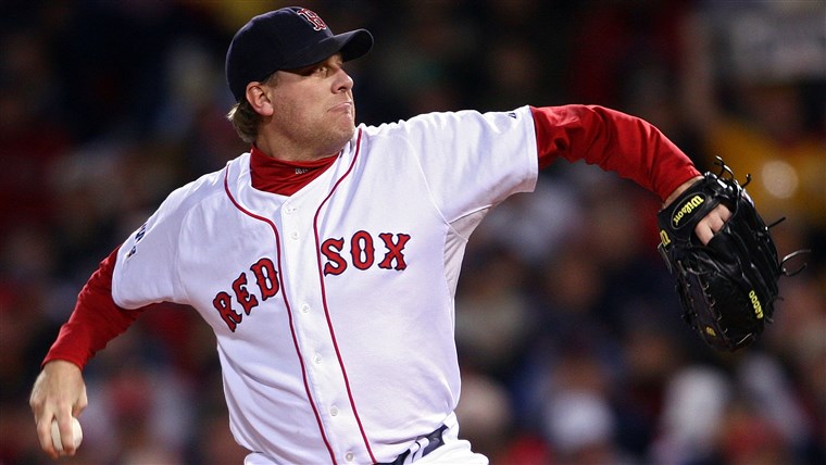 Curt Schilling #38 of the Boston Red Sox pitches against the Colorado Rockies