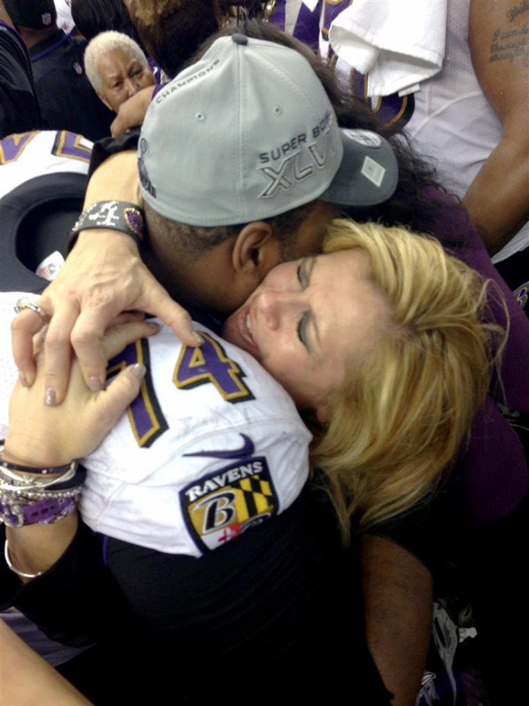 Tuohy hugs son Michael Oher after the Ravens 2013 Super Bowl win.