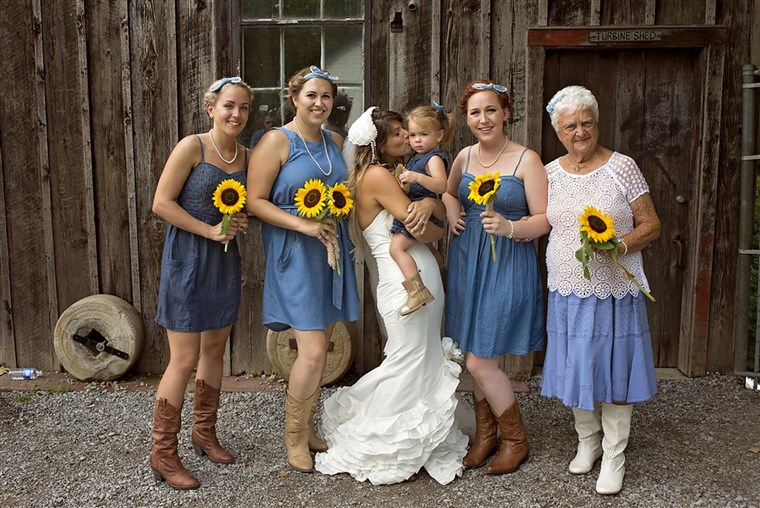 Das bridesmaids all wore denim outfits and cowboy boots. 