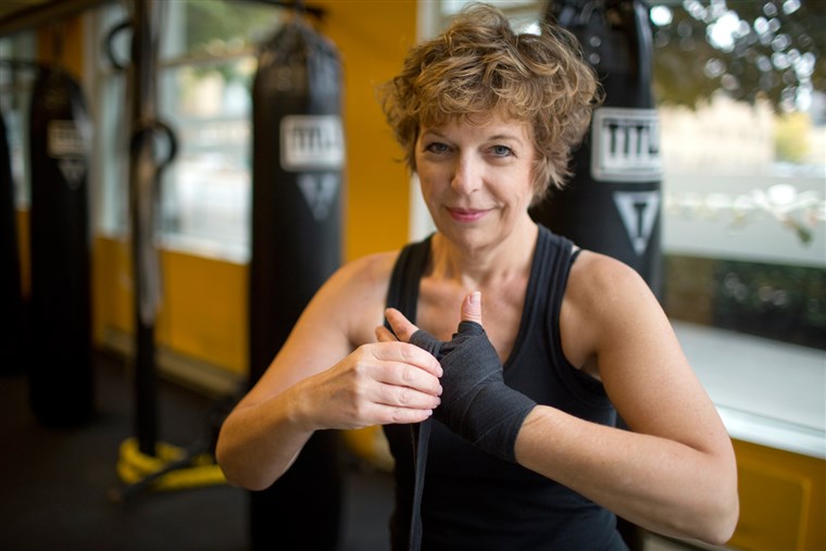 黛安 Mapes, seen here wrapping her hands before working out at Axtion Club boxing gym in downtown Seattle, ...