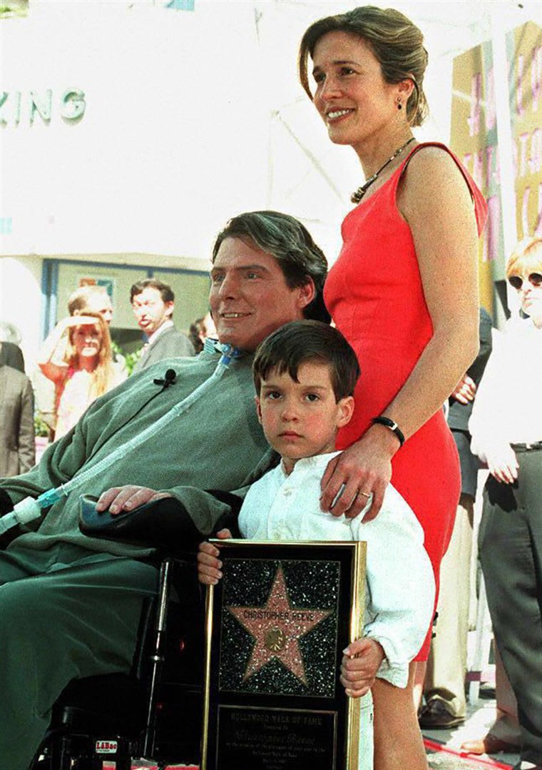 LOS ANGELES, UNITED STATES: Actor-Director Christopher Reeve poses for journalists with his wife, Dana, and their son, Will, after being honored with...