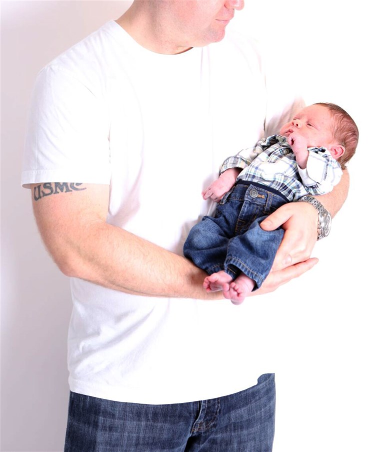 دنيس Cosgrove holding baby Declan