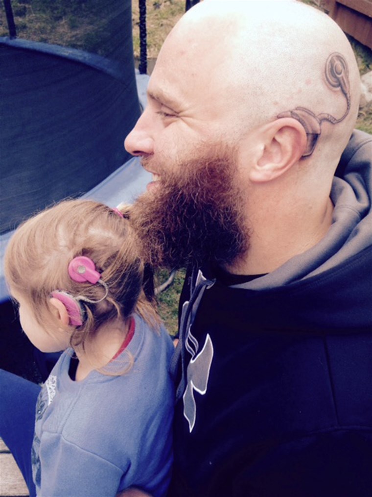 Táto's cochlear implant tattoo matches the real one worn by daughter.
