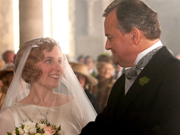 休 Bonneville (Lord Grantham) prepares to give away daughter Edith (Laura Carmichael) at her short-lived wedding.