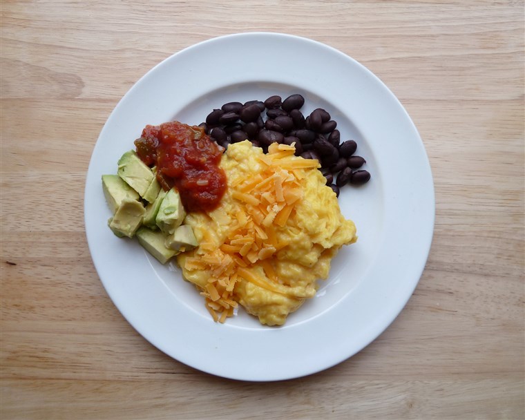 Míchal se eggs with black beans, cheese, salsa and avocado