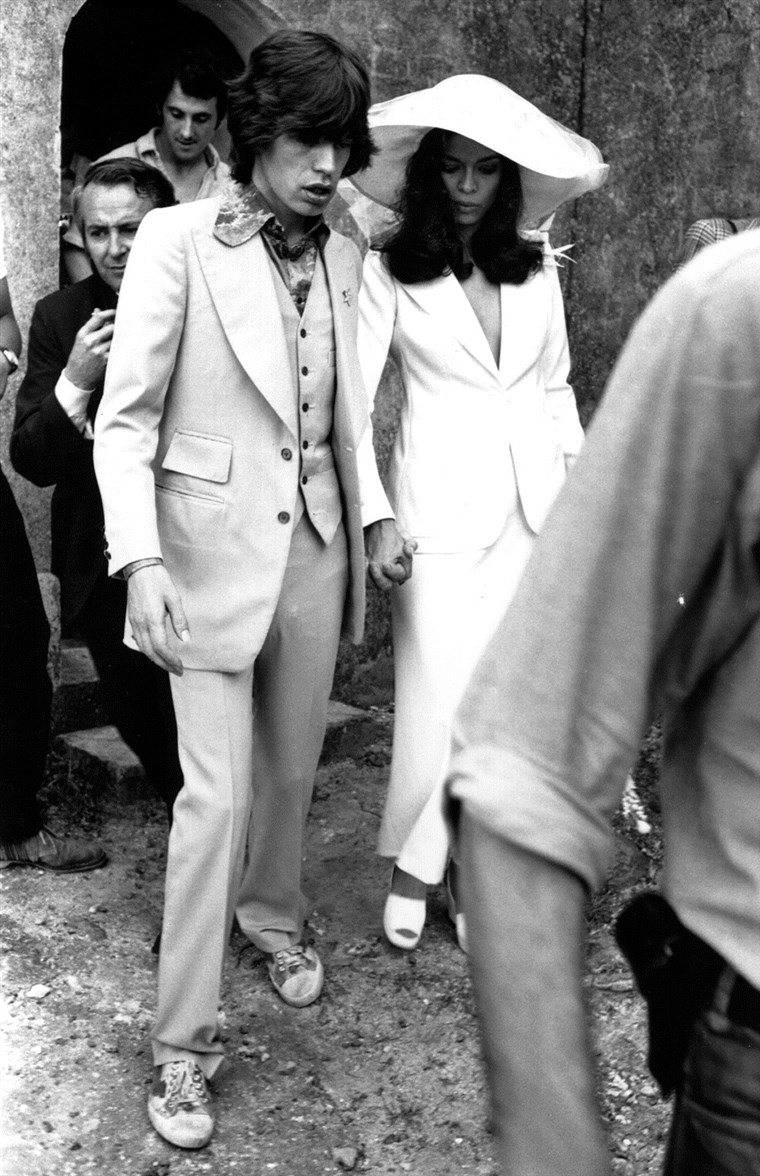 Válcování Stones singer Mick Jagger and his wife Bianca.