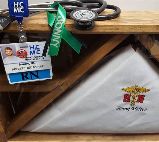 Sonny's personal items, including his identification badge for the hospital where he worked as a nurse.