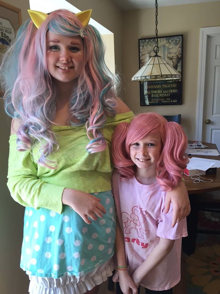 Alice, 14, and Daisy, 10, dressed up for Halloween last year. Alice hasn't stopped going out for the holiday even though she's a teen.