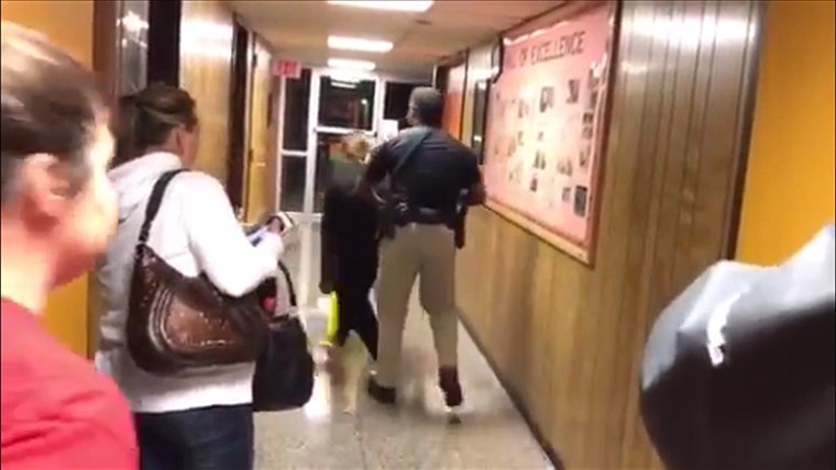 А marshal throws Deyshia Hargrave out of Vermilion Parish School Board's meeting on Monday. 
