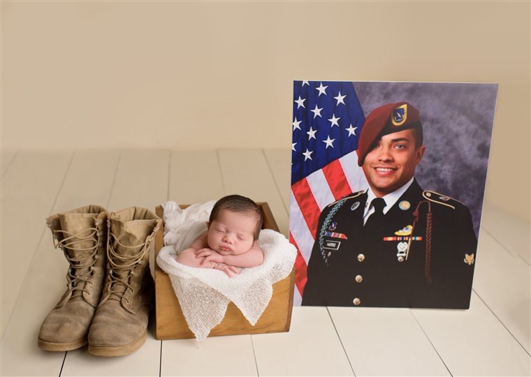 Baby poses in military uniform of father she'll never meet