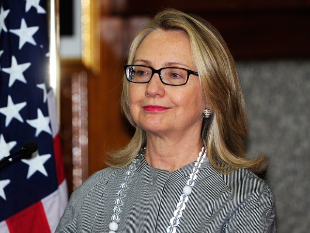 她 looks a bit relieved, no? A makeup-less Hillary Clinton looks on during a press conference in Dhaka on March 5.