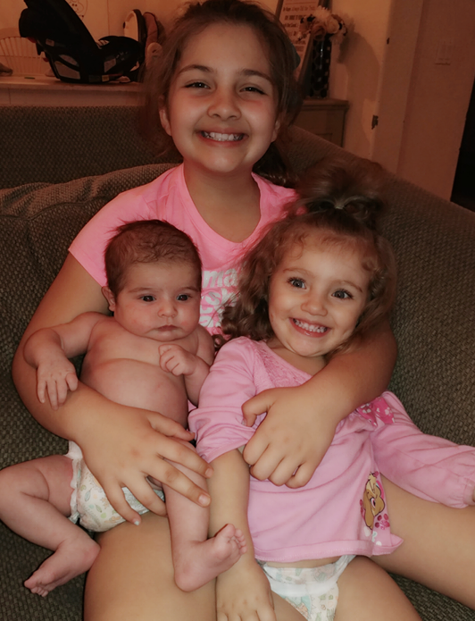 Brooke with her sisters, Ellie, 2, and Summer, 5 weeks.